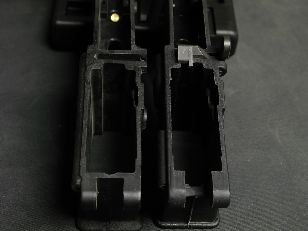 The magwell and front takedown pin areas on both